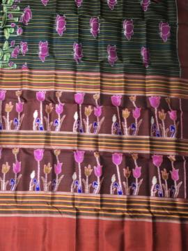 Exclusively woven flower motifs Aanchal with body stripes and lotus motifs Khandua silk saree