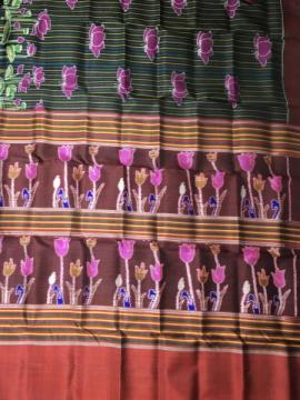 Exclusively woven flower motifs Aanchal with body stripes and lotus motifs Khandua silk saree