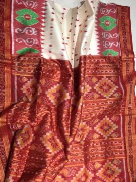 Exclusively woven Laxmi feet border Ikat weave Khandua silk saree without blouse piece