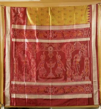 Exclusively woven Master weaver s creation of Dancers border Temple theme Ikat Silk Saree