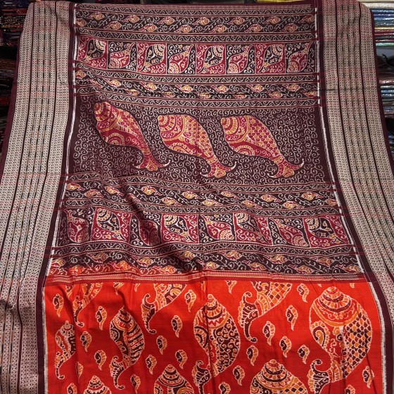 Master weaver s creation intricately woven conch motifs Cotton Ikat Saree