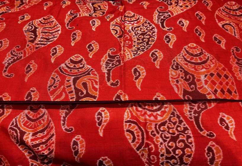 Master weaver s creation intricately woven conch motifs Cotton Ikat Saree